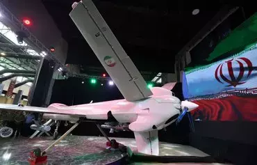 A picture shows the new Iranian Mohajer-10 drone during Iran's defense industry achievement exhibition in Tehran on August 23. [Atta Kenare/AFP]