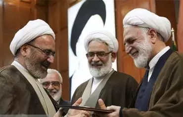 Mohammad Mosaddegh Kahnamoui (L) being appointed as judiciary chief Gholam-Hossein Mohseni-Ejei's first deputy. [Fars]