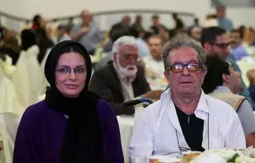 Iranian film director Dariush Mehrjui and his wife Vahideh Mohammadifar attend a ceremony in Tehran on July 1, 2015. [Abdolvahed Mirzazadeh/ISNA/AFP]