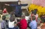 
A teacher interacts with her students in a classroom in Iran, where the government has announced a ban on foreign language education for young children. [Asriran]        