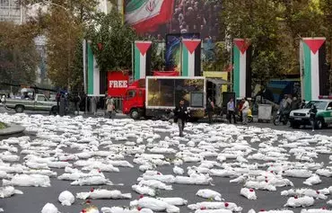 An installation featuring mock shrouded bodies of children set up in Tehran's Palestine Square in Iran on November 13. Iran has done little beyond talk in support of Palestinians amid the ongoing war in Gaza, observers say. [Atta Kenare/AFP]