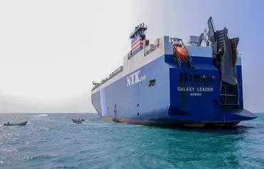A picture taken during an organized tour by the Houthis on November 22 shows the Galaxy Leader cargo ship, seized by Houthi fighters three days earlier, at a port on the Red Sea in al-Hodeidah. [AFP]
