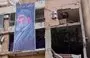 
A photograph taken January 8 shows a banner depicting Hizbullah chief Hassan Nasrallah on a building hit by a drone attack that killed a Hamas leader in Beirut's southern suburb on January 2. Hizbullah operates a joint operations room with other Iranian proxies in Beirut. [Anwar Amro/AFP]        