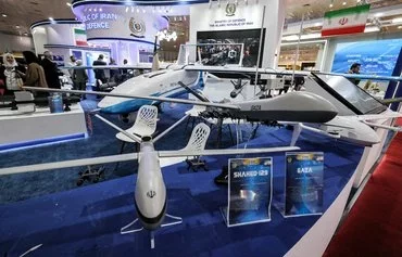 Mockups of Iran's Shahed-129 and Shahed-149 'Gaza' drones on display at the 2024 International Defense Exhibition Iraq (IQDEX) in Baghdad. [Ahmed al-Rubaye/AFP]