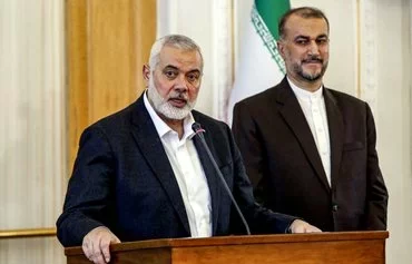Ismail Haniyeh, the Doha-based political bureau chief of Hamas, speaks to the press in Tehran on March 26 after a meeting with Iranian Foreign Minister Hossein Amir-Abdollahian. The foreign minister was killed in a May 19 helicopter crash in Iran. [AFP]