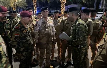 Iraqi forces deploy at the site of a franchise of a US brand in Baghdad on May 30, after it was targeted with an explosive device. [Security Media Cell]