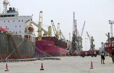 Ships are docked for unloading in Yemen's Houthi-held port of al-Hodeidah last July 15. [Mohammed Huwais/AFP]