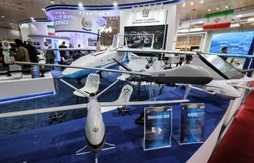 This picture taken on April 21 shows a view of mockups of Iran's Shahed 129 and Shahed 149 'Gaza' unmanned combat aerial vehicles (UCAVs or drones) on display at the 2024 International Defence Exhibition Iraq (IQDEX) in Baghdad. [Ahmad al-Rubaye/AFP]