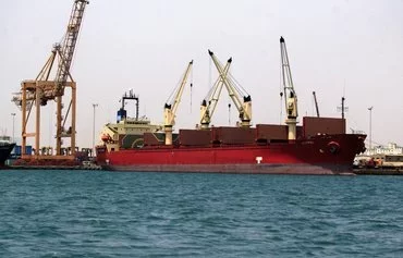 A ship is docked for unloading in Yemen's Houthi-held port of al-Hodeidah on July 15, 2023. [Mohammed Huwais/AFP]