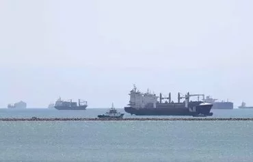 Merchant ships transit the Red Sea. [Ahmed Hasan/AFP]