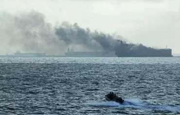 A Singapore Navy vessel heads to a life raft near the Singapore-flagged tanker Hafnia Nile and crude oil tanker Ceres 1 following a July 19 collision. [Singapore Navy]