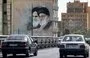 
A mural in Tehran shows Islamic Republic founder Rouhollah Khomeini and Iranian leader Ali Khamenei on September 10, 2023. [Atta Kenare/AFP]        