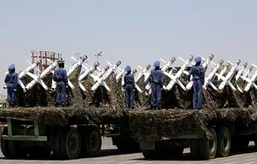 Houthi fighters stand on a missile carrier during a September 21, 2023 military parade in Sanaa. [Mohammed Huwais/AFP]