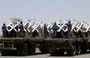 
Houthi fighters stand on a missile carrier during a September 21, 2023 military parade in Sanaa. [Mohammed Huwais/AFP]        