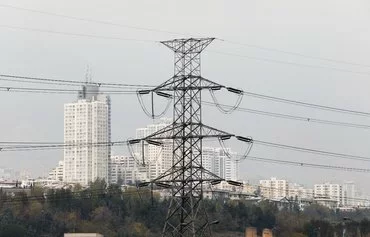 An electricity transmission tower in Tehran is seen November 12, a day after electricity rationing went into effect. [Atta Kenare/AFP]