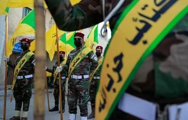 Kataib Hizbullah elements attend the funeral of a member of the so-called 'Islamic Resistance in Iraq,' on November 21, 2023. [Ahmad al-Rubaye/AFP]