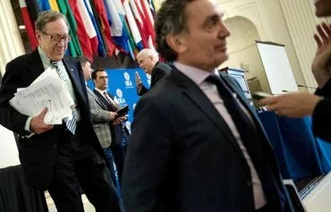 Former Canadian Justice Minister Irwin Cotler (L) leaves a press conference at the Organization of American States headquarters in Washington on May 29, 2018. [Brendan Smialowski/AFP]