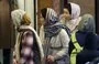 
Women wearing the mandatory headscarf look into a shop window in Tehran on December 12. [AFP]        