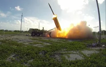 A Terminal High Altitude Area Defense (THAAD) interceptor is launched from a battery on Wake Island during a flight test conducted November1, 2015. [Ben Listerman/Missile Defense Agency]