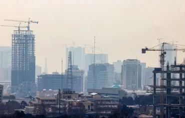 Smog engulfs Tehran on December 16. [Atta Kenare/AFP]